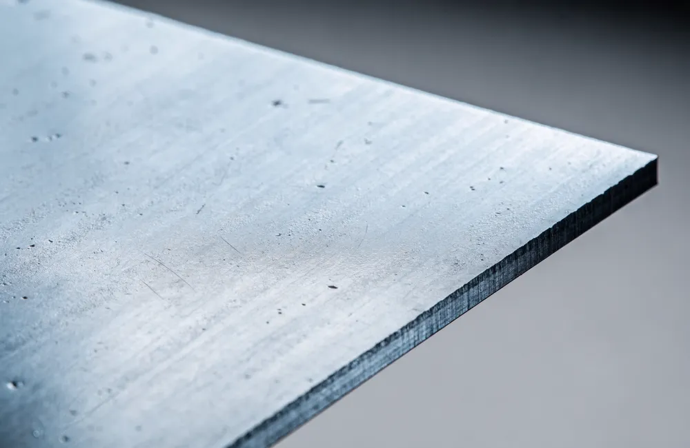 Laser-cut mild steel sheet with a mill finish and cut edge